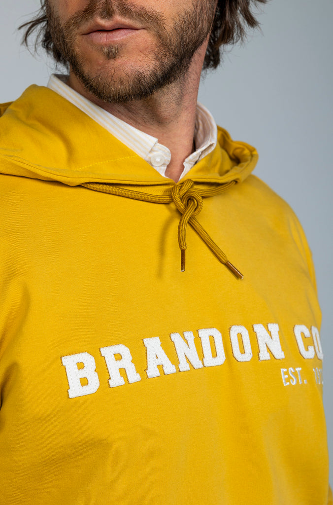 Sudadera Lettering Mostaza Capucha