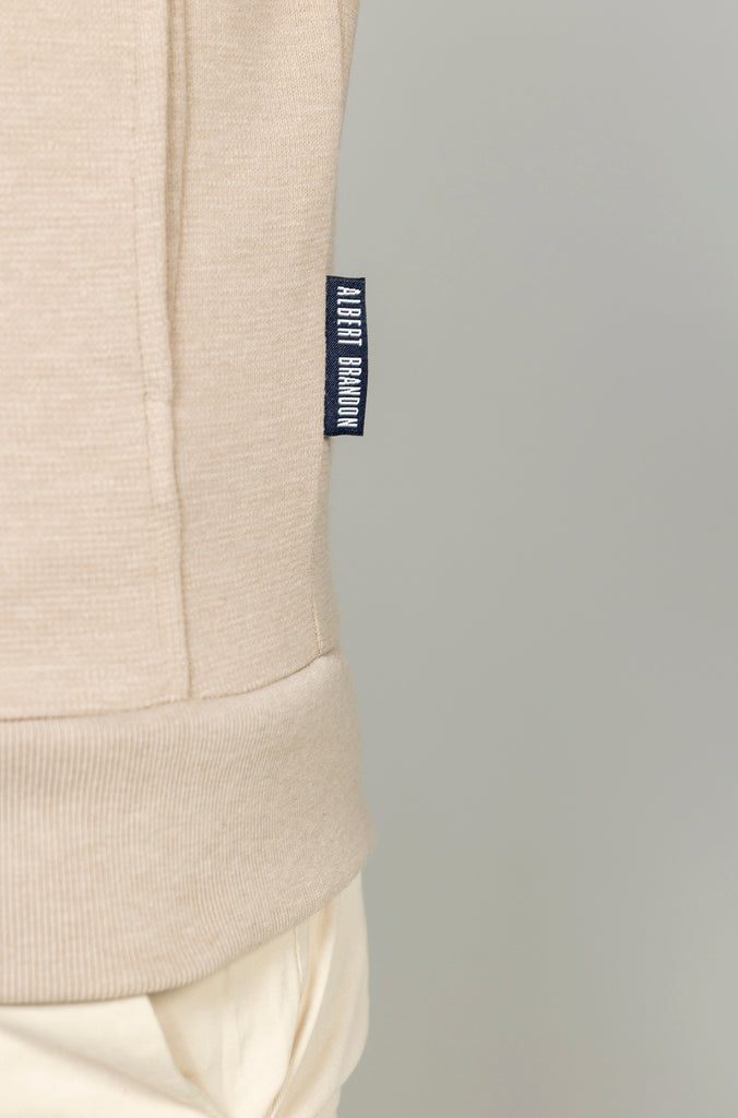 Sudadera bomber cremallera bolsillo crema